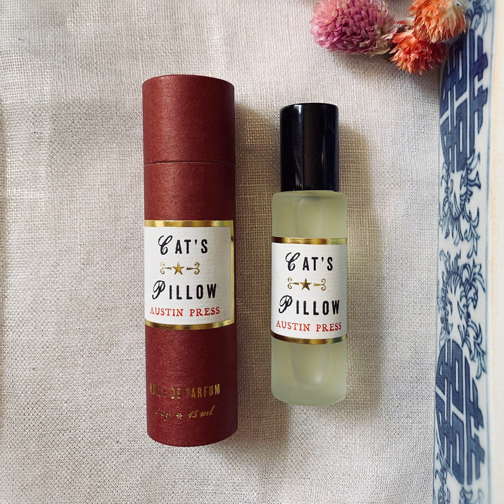 Cat's Pillow Roll on perfume, scented of Lavandin Grosso, Green Herbs, Tonka, Rosemary and Ginger.